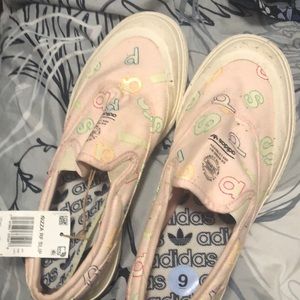 It’s a pink loafers sneakers Adidas size 9